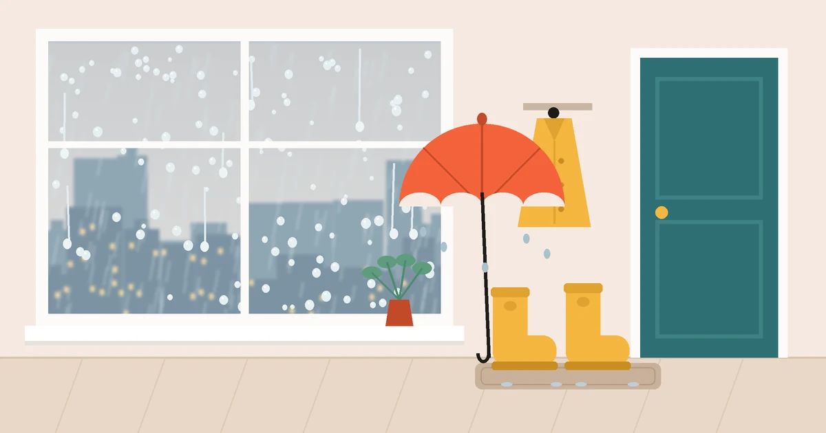 Rain running down a window over a grey city skyline, with an orange umbrella, yellow rain boots on a doormat and a yellow raincoat hanging by the front door.
